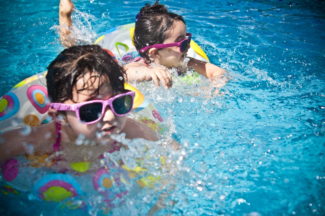 Kids swimming in a pool at East Mesa, AZ.